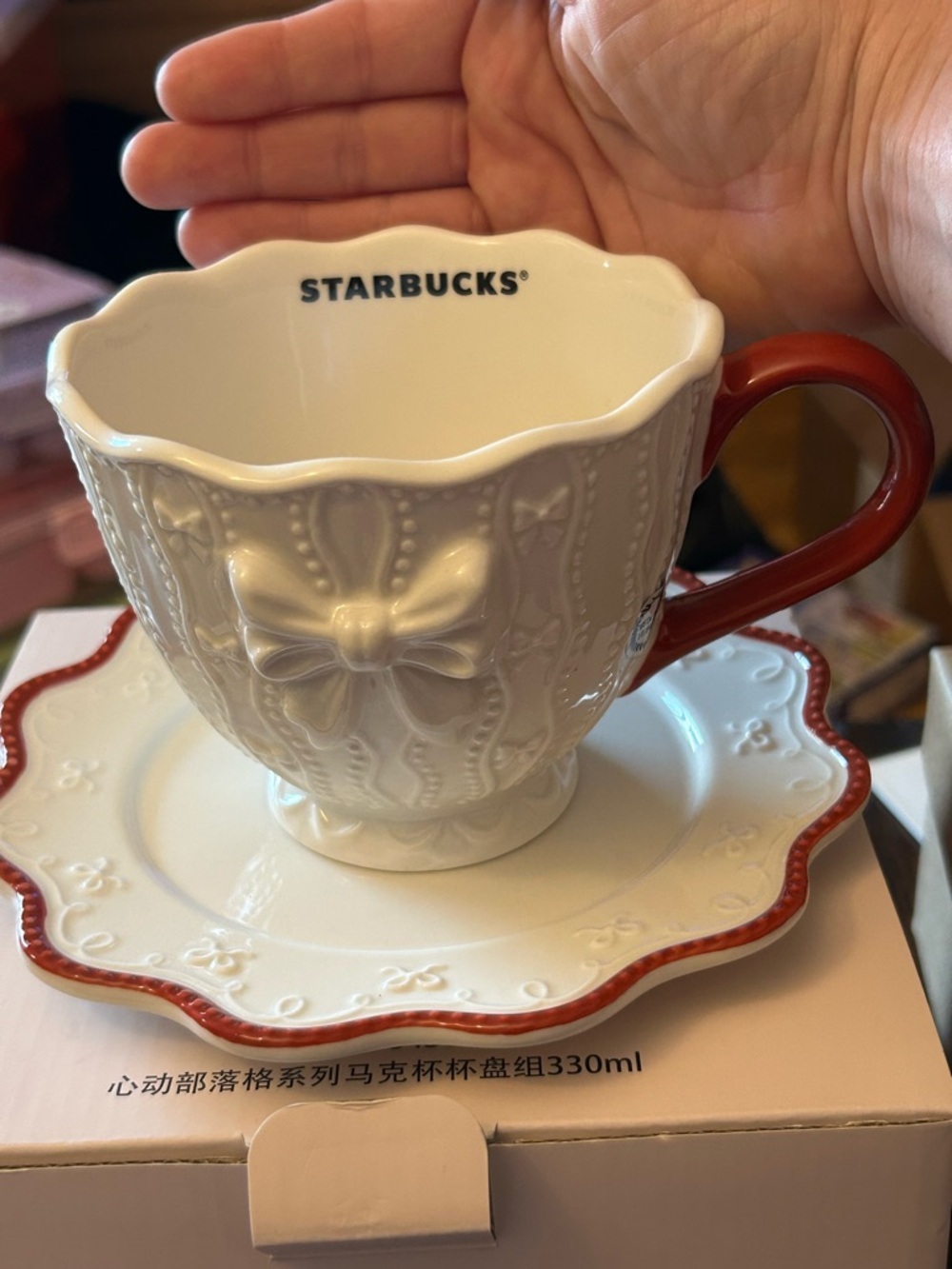 Starbucks White Embossed Bow Teacup & Saucer with Red Handle  Asia exclusive